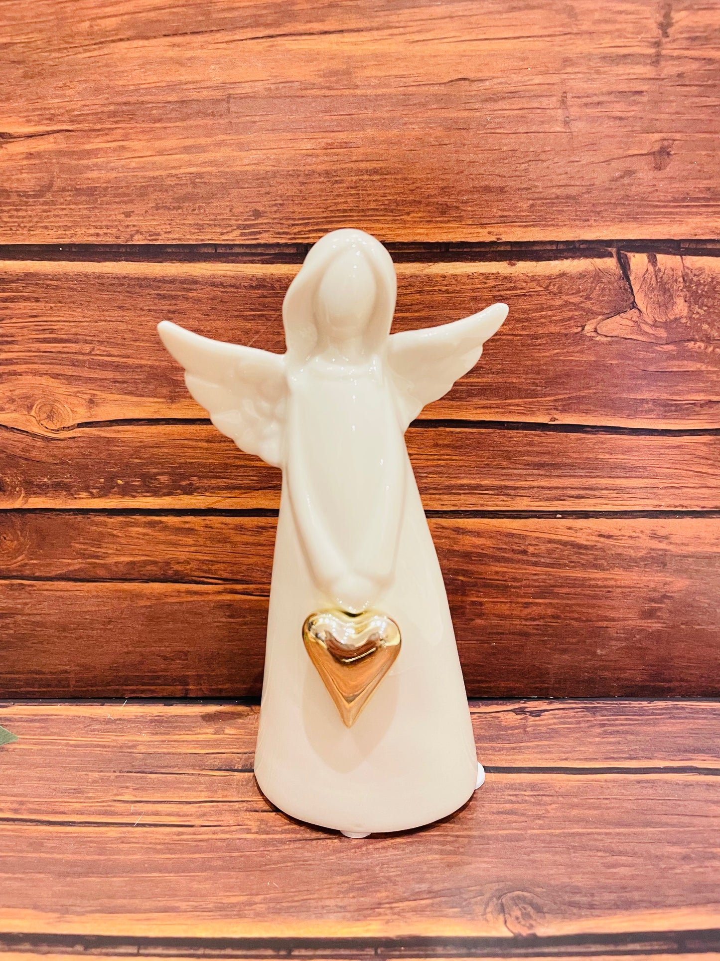 Angel Holding Gold Heart